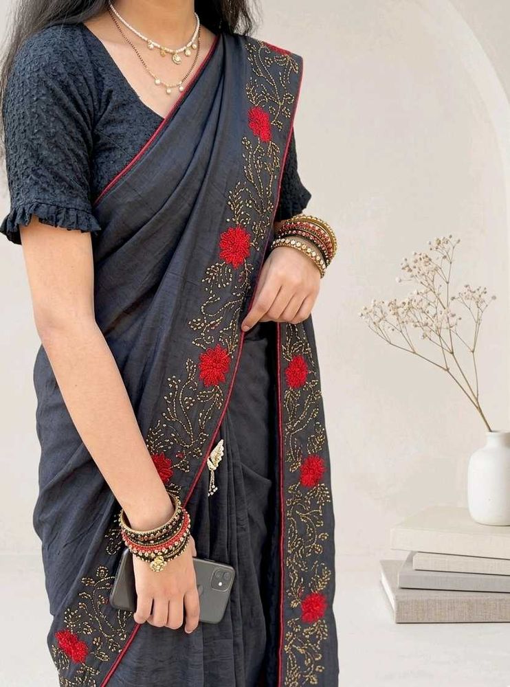 Elegant Black Saree with Red Floral Embroidery