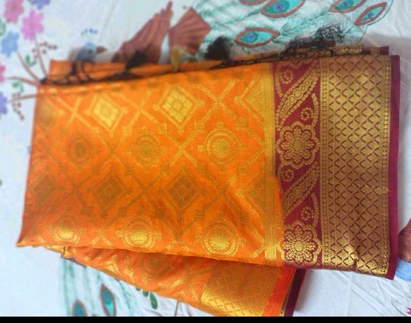 Orange Silk Saree with Golden Border
