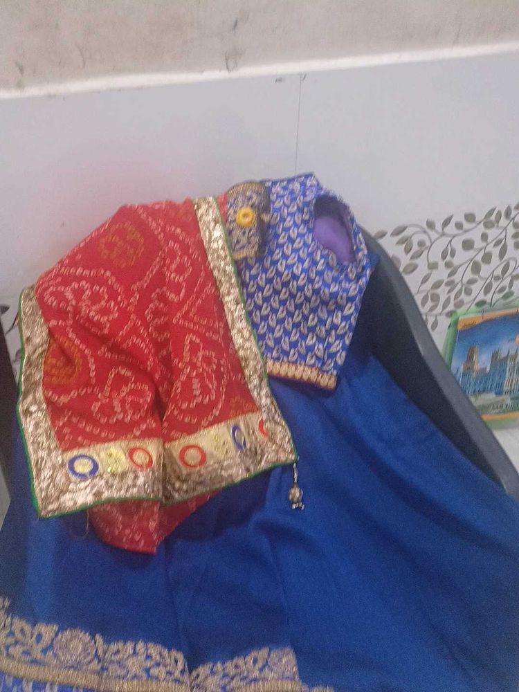 1) Royal Blue Lehenga Choli with Red Dupatta.  2)