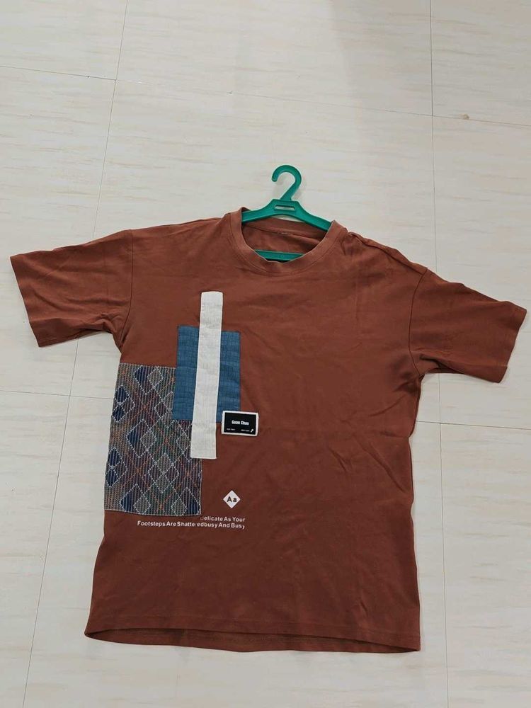 oversized Brown T-shirt with graphic patchwork art