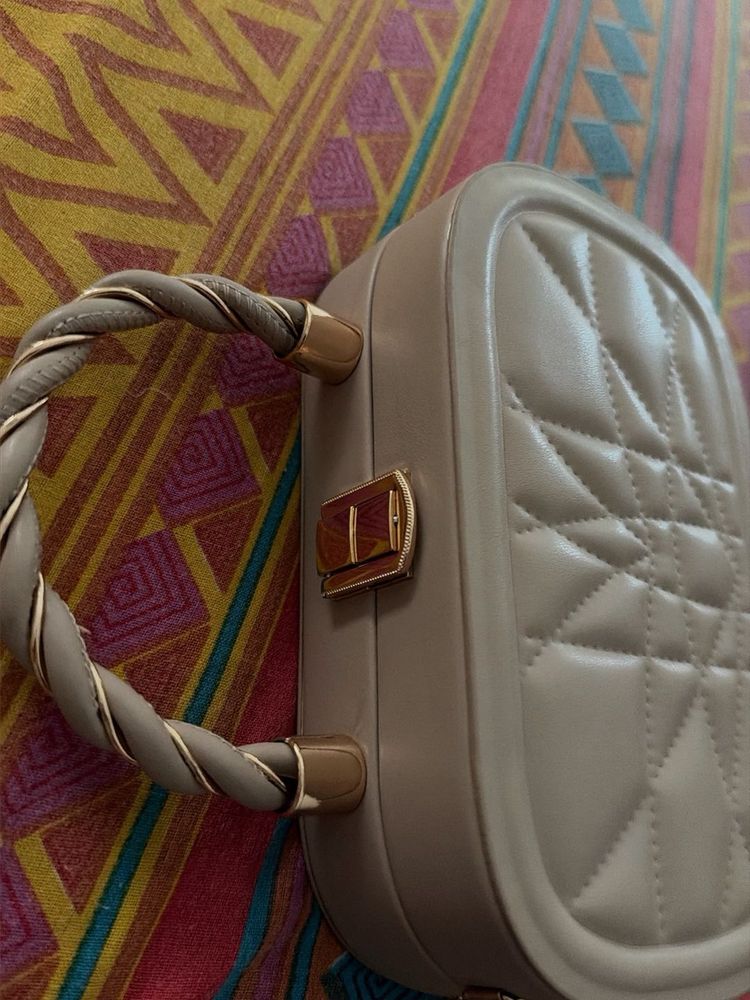 Quilted Oval Handbag