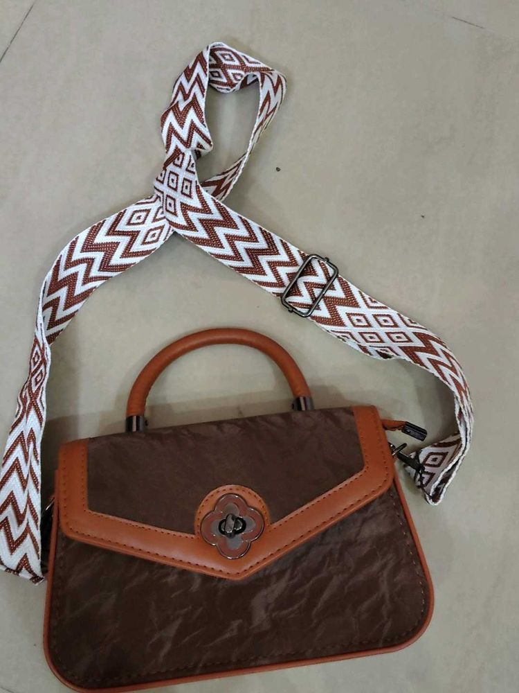 Chic Brown Handbag with Trendy Strap