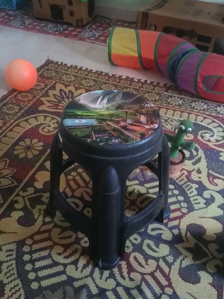 Black plastic stool