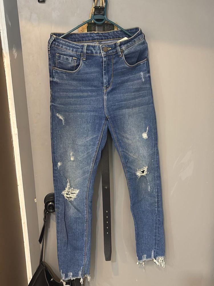 Distressed Blue Denim Jeans