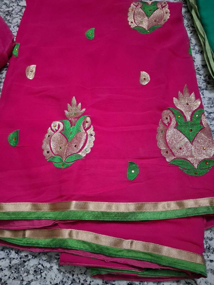 Vibrant Pink Saree with Peacock Motifs