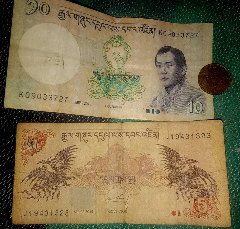 Bhutan 2  notes and  Nepal coin