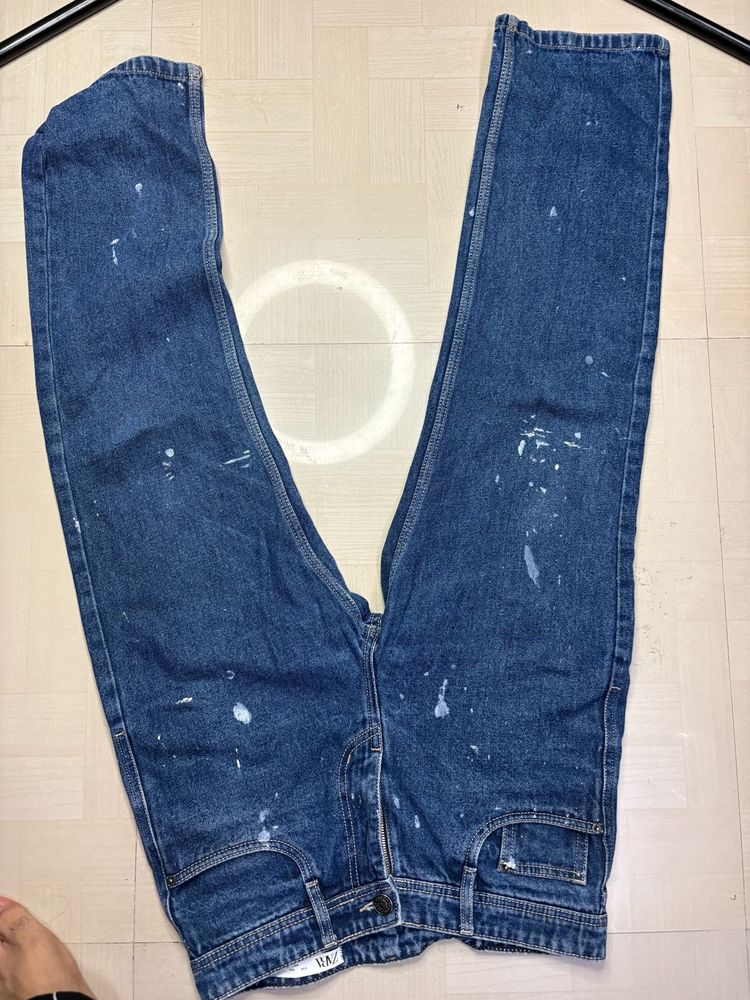 Stylish Blue Jeans with Paint Splatter Detail