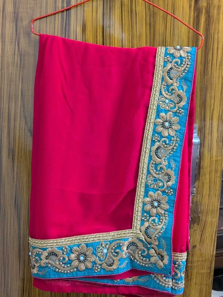 Elegant Red Saree with Green  Embroidery