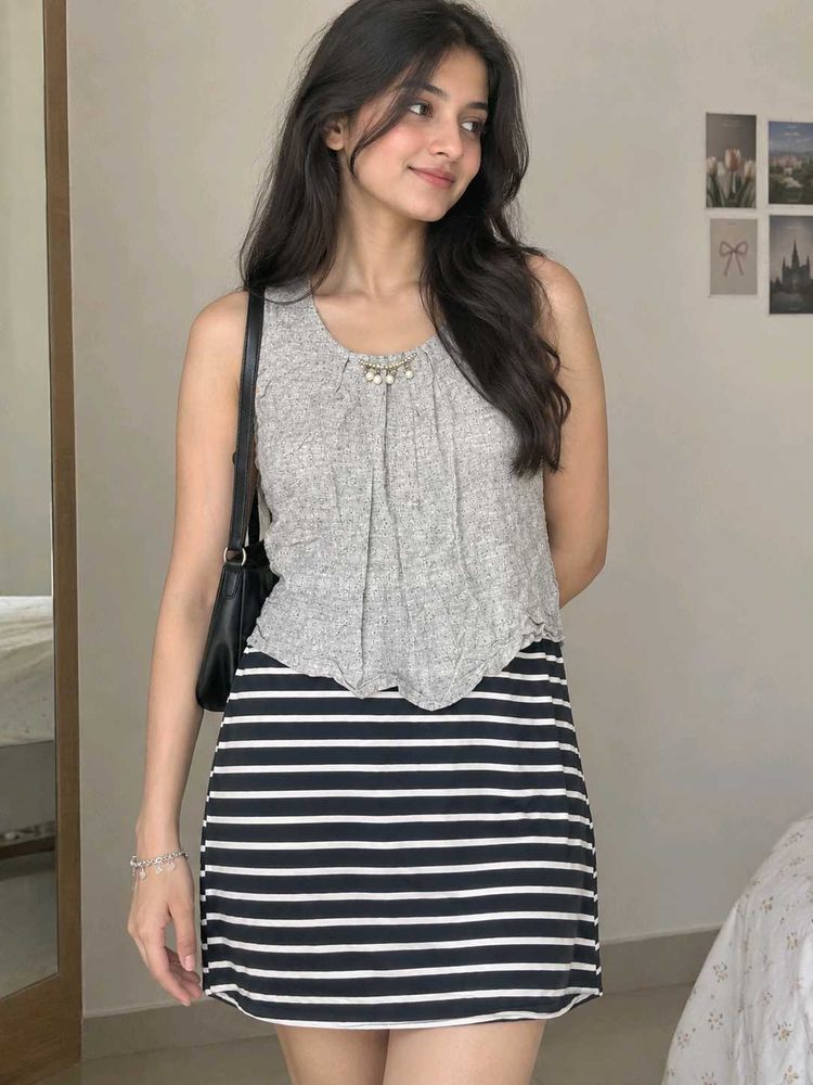 Chic Grey Sleeveless Top with Embellished Neckline