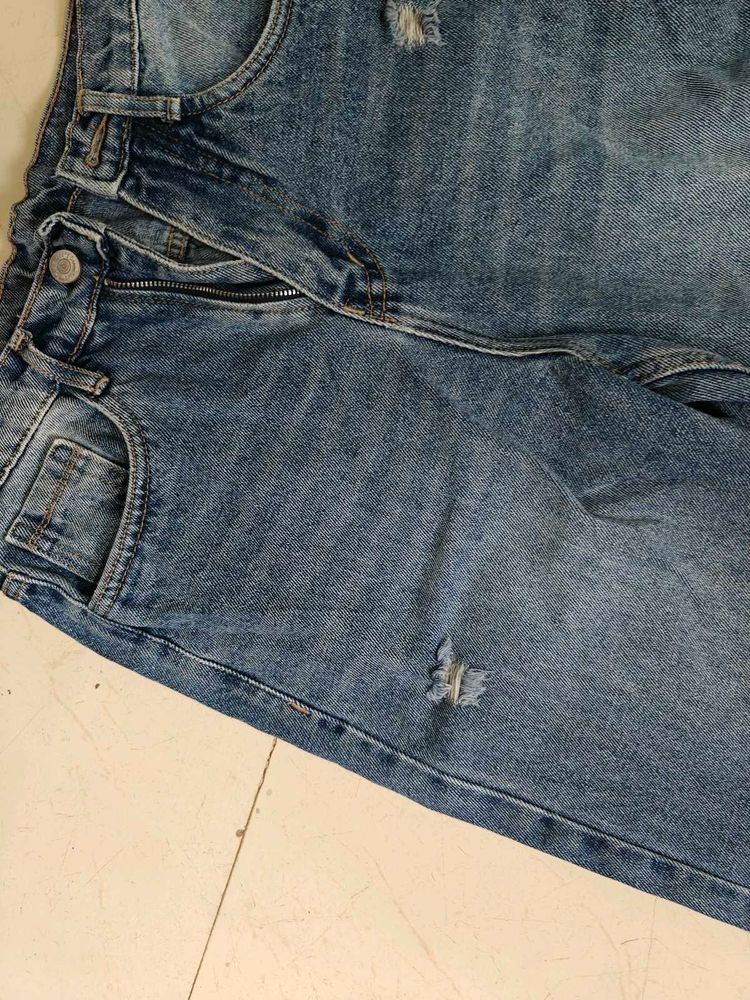 Distressed Blue Denim Jeans