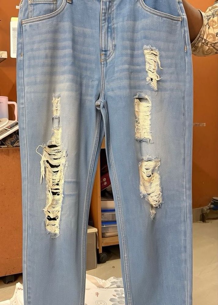 Distressed Light Wash Denim Jeans