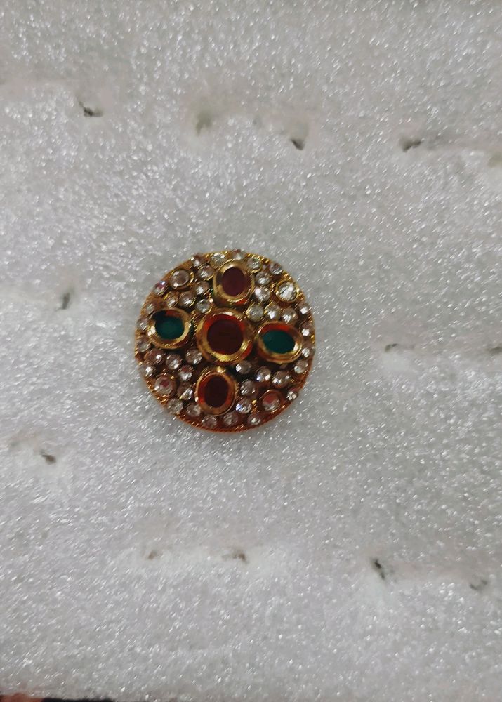 golden ring with Red and green stone