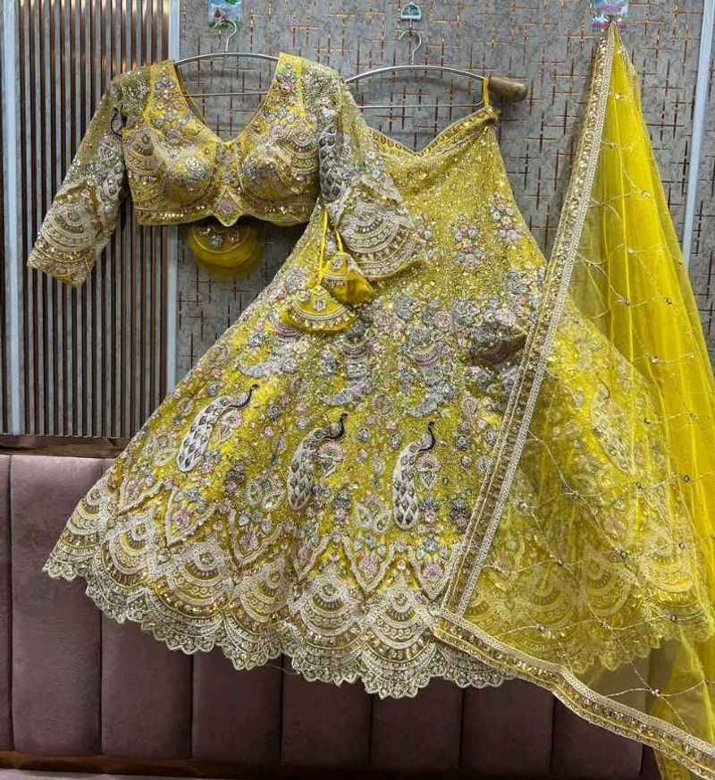 Stunning Yellow Peacock Embroidered Lehenga Choli
