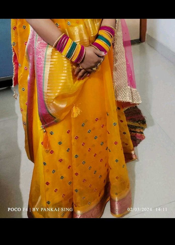 Vibrant Yellow Saree with Multi-Color Bangles