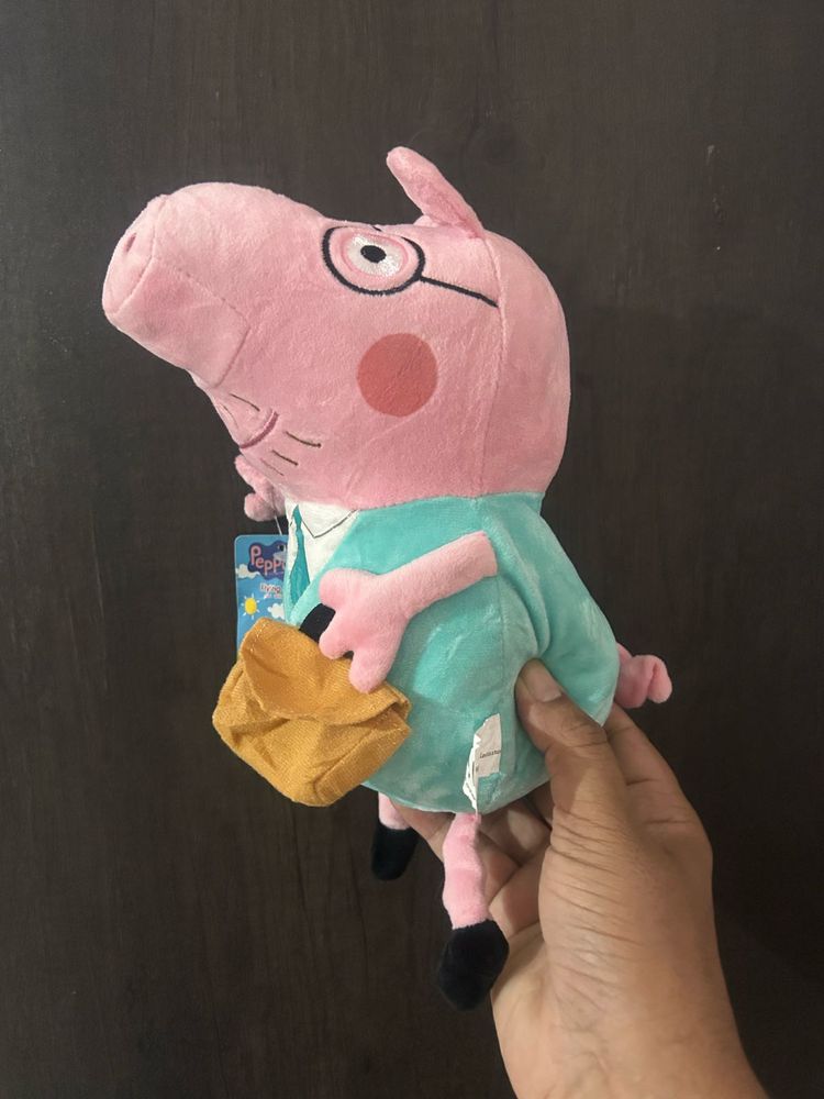 Daddy Pig from Peppa holding his briefcas