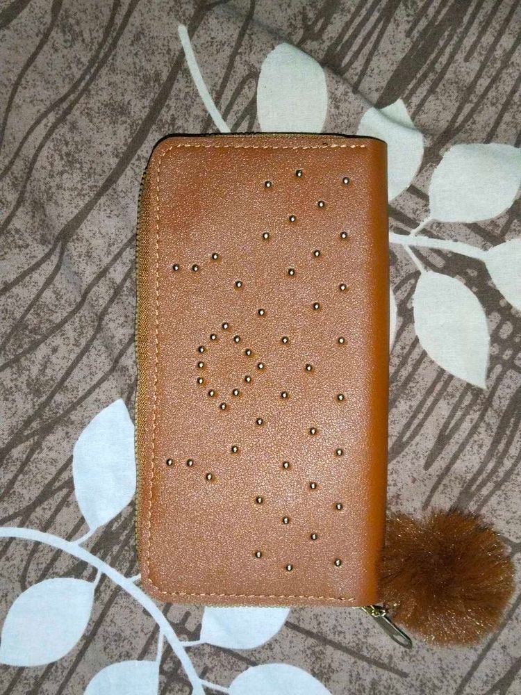 Stylish Tan Wallet with Pom-Pom Charm
