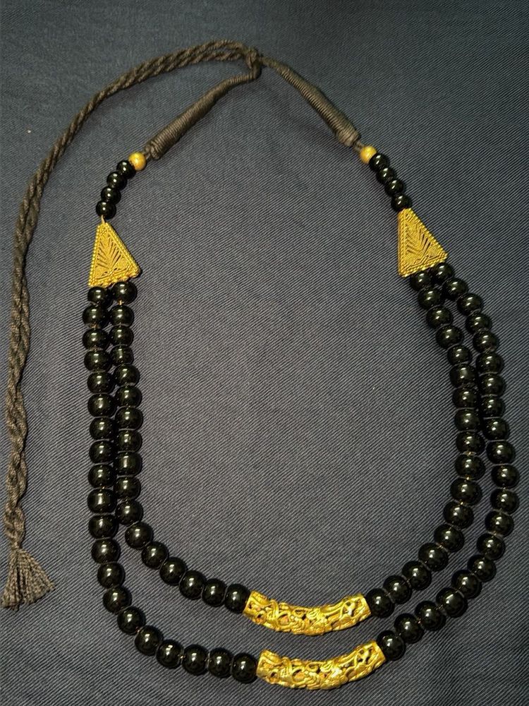 Black beads and golden finish costume jewellery