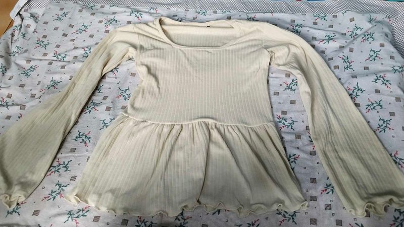 Cream Ribbed Bell Sleeve Peplum Top