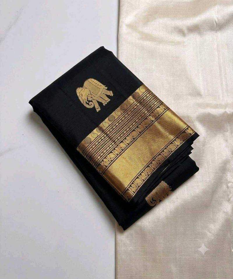 Elegant Black Saree with Gold Elephant Motif