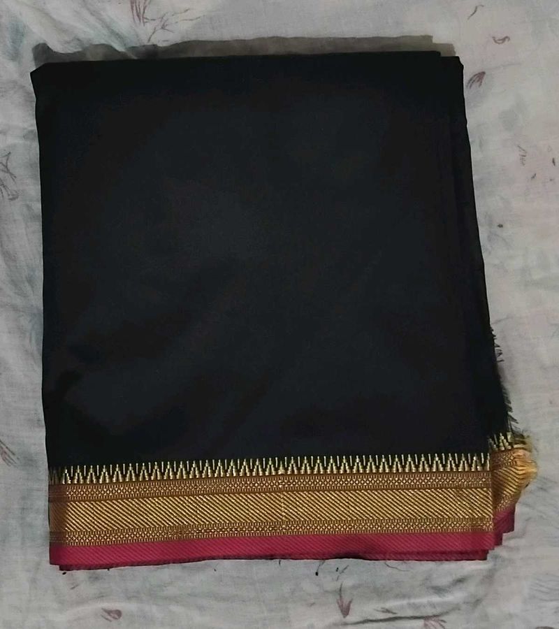 Elegant Black Saree with Gold Border