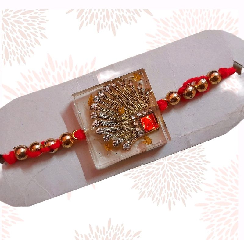 Glamorous Rakhi with Red &amp; Gold Accents