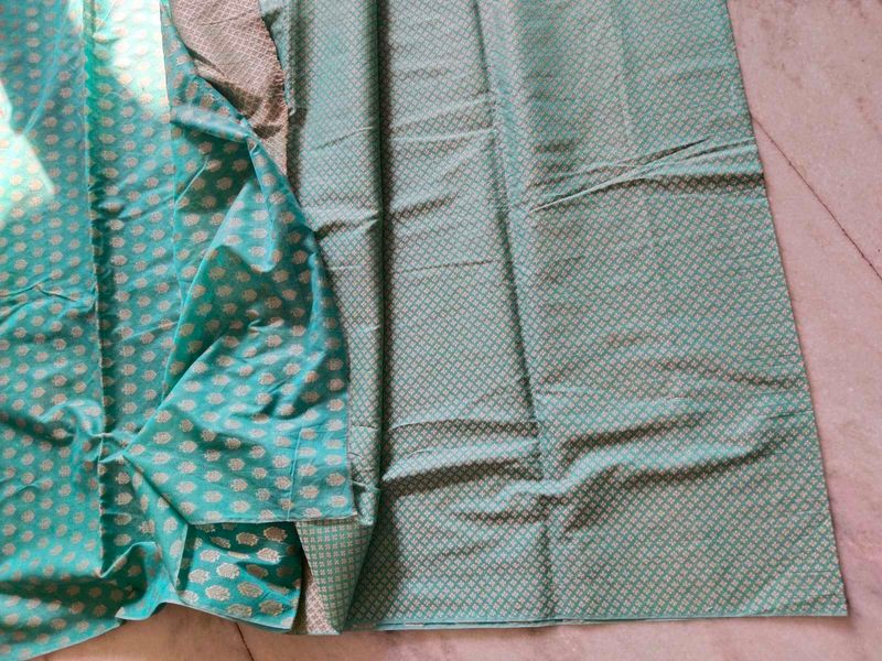 Beautiful Teal dress material with woven silk work