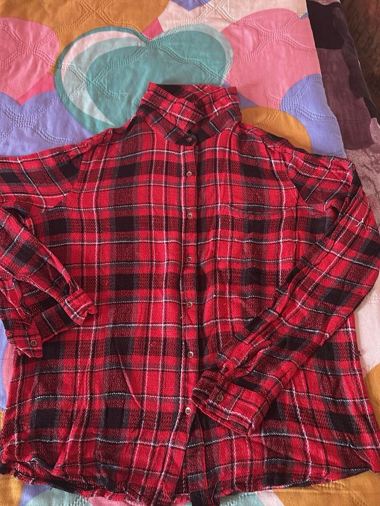 Red and black plaid flannel shirt.