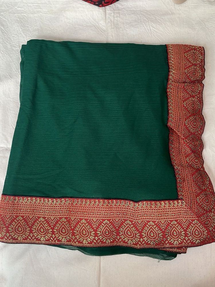 Elegant Green Saree with Red Border