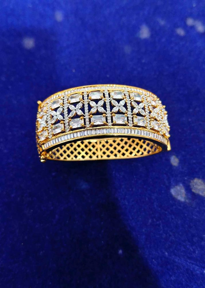 Elegant Gold Bangle with White Stones