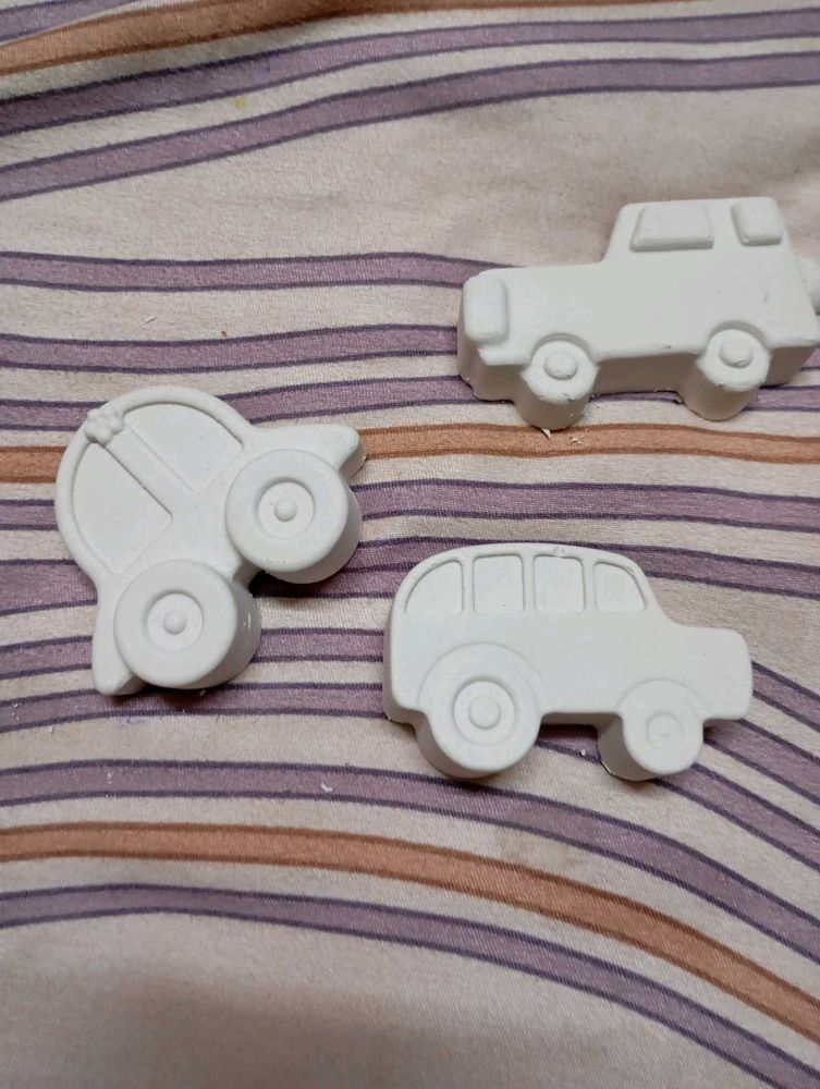x3 pieces of concrete art cars