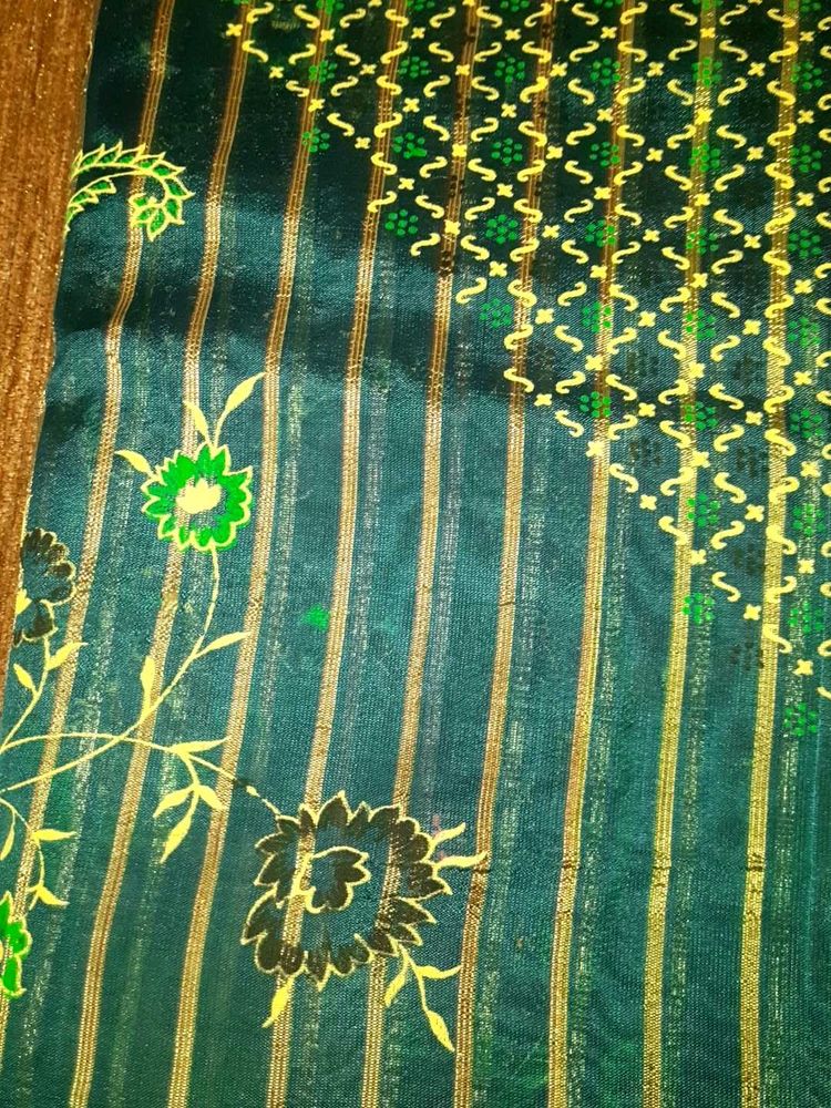 Teal Saree with Gold Print ,without blouse.