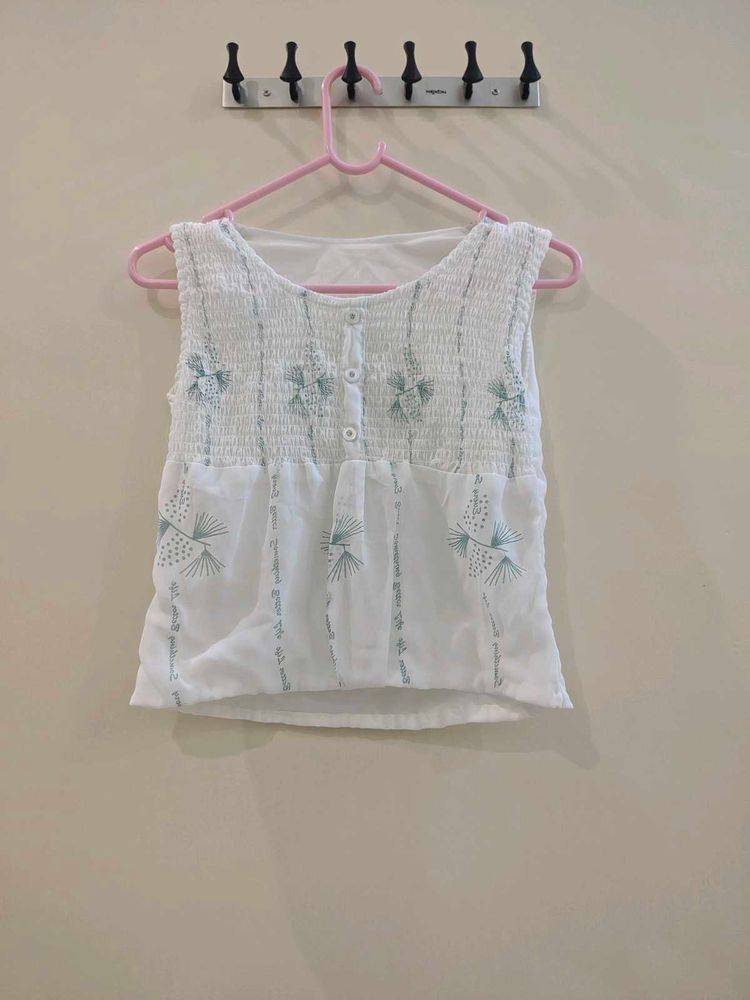 White Embroidered Sleeveless Blouse