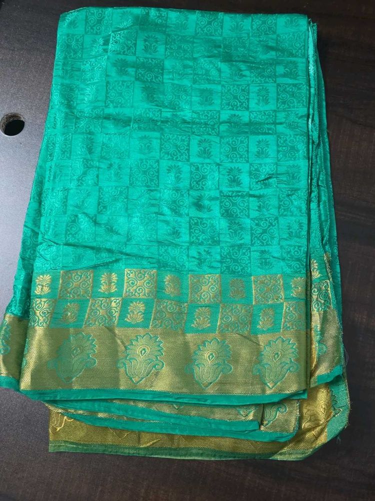 Elegant Teal Saree with Gold Border