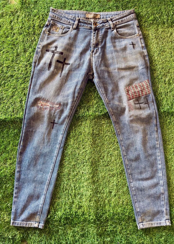 Distressed Blue Jeans with Cross Appliques