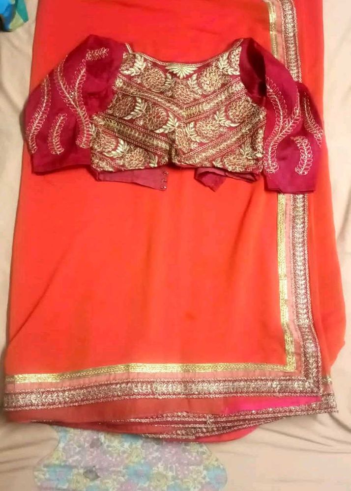 Stunning Orange Saree with Embroidered Blouse