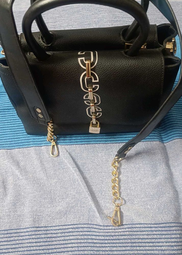Stylish Black Handbag with Gold Chain Detail
