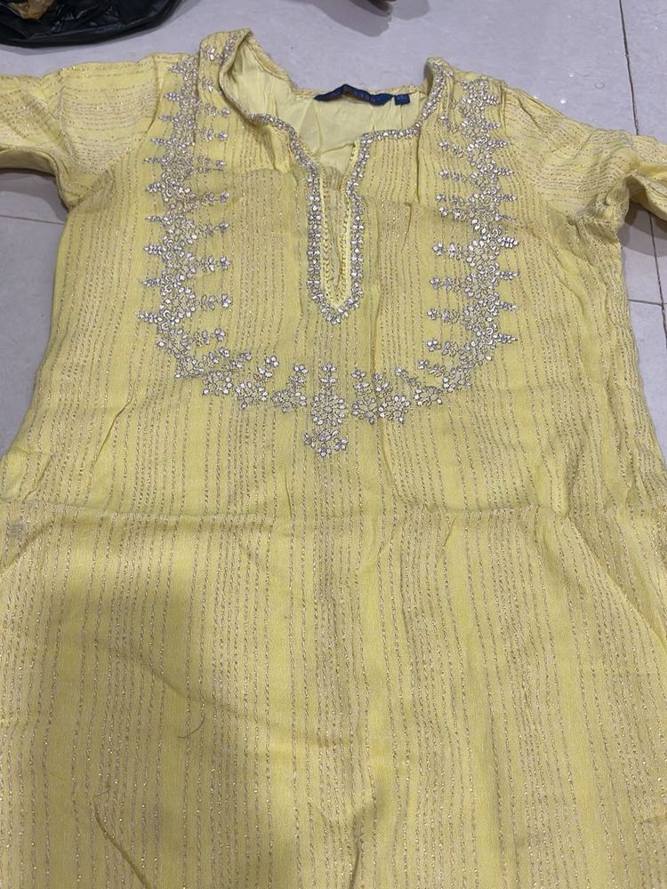 Elegant Yellow Kurta with Intricate Embellishments