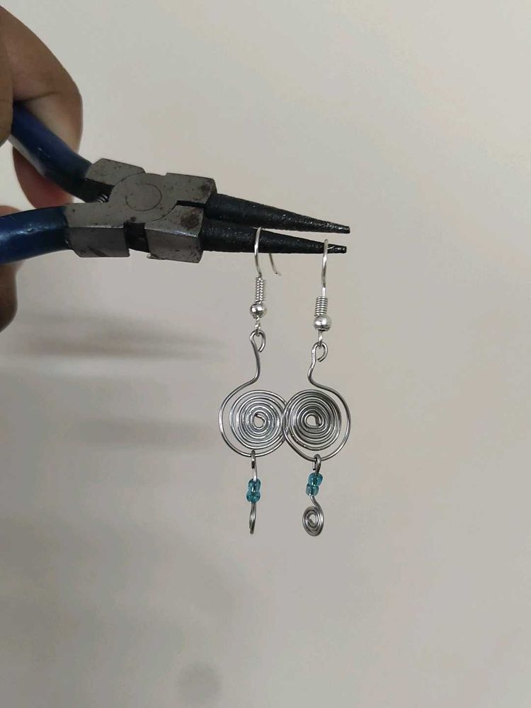 Silver Swirl Earrings with Blue Beads