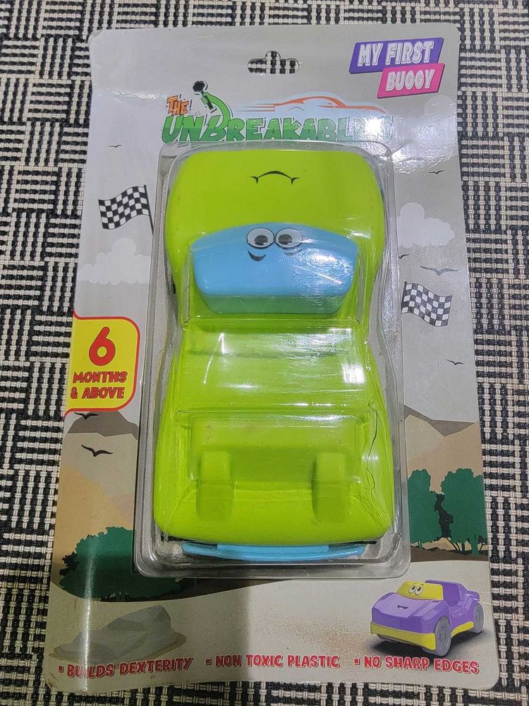 Two toys - Buggy and Racing car to