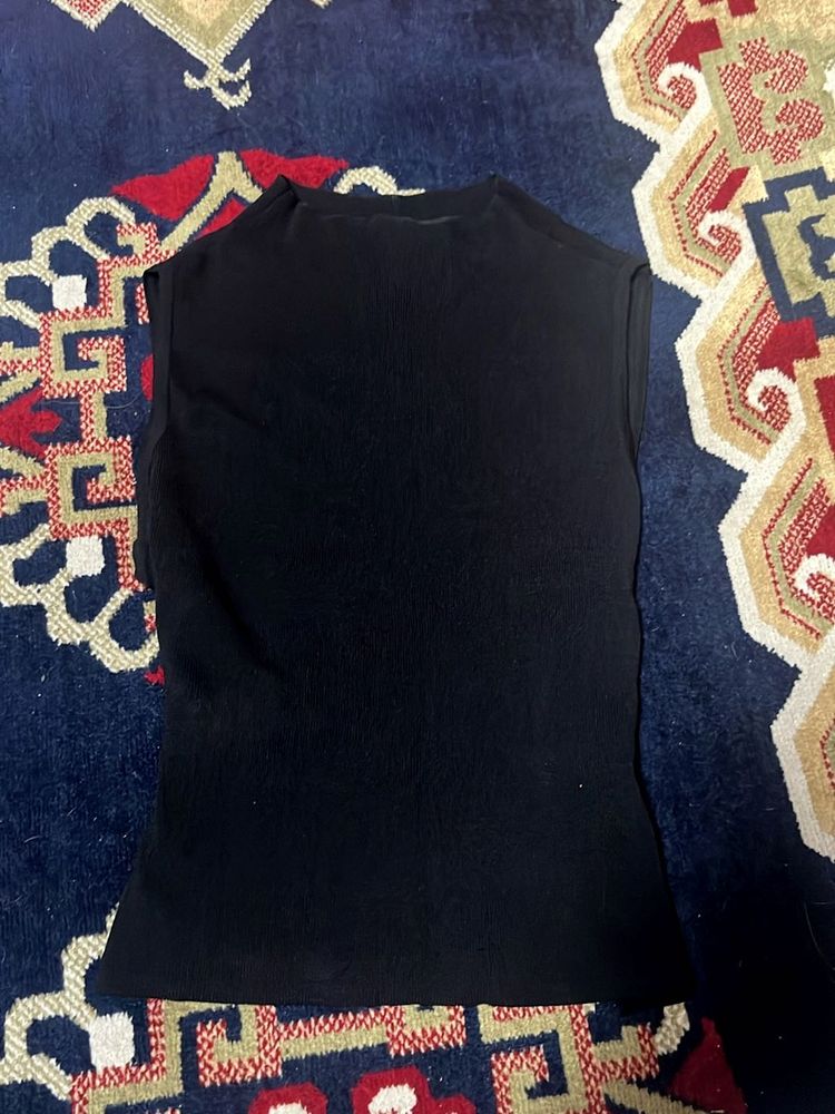 Sleek Black Sleeveless Turtleneck Top