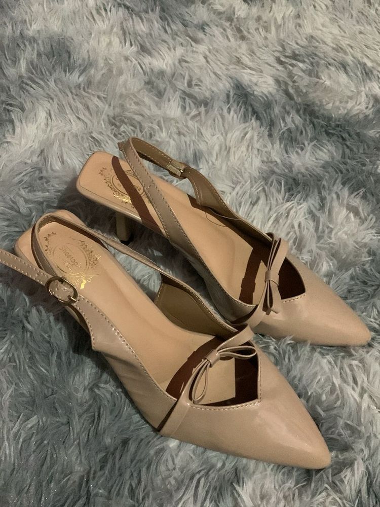 Chic Nude Slingback Heels with Bow Detail