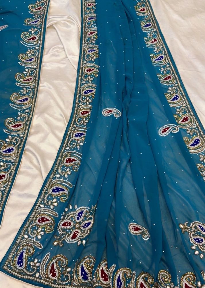 Exquisite Teal Embroidered Saree