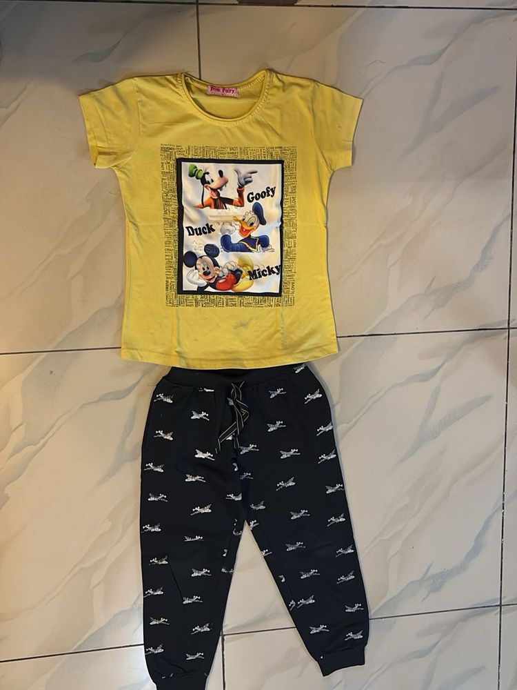 yellow Cartoon T-shirt and black sports lower