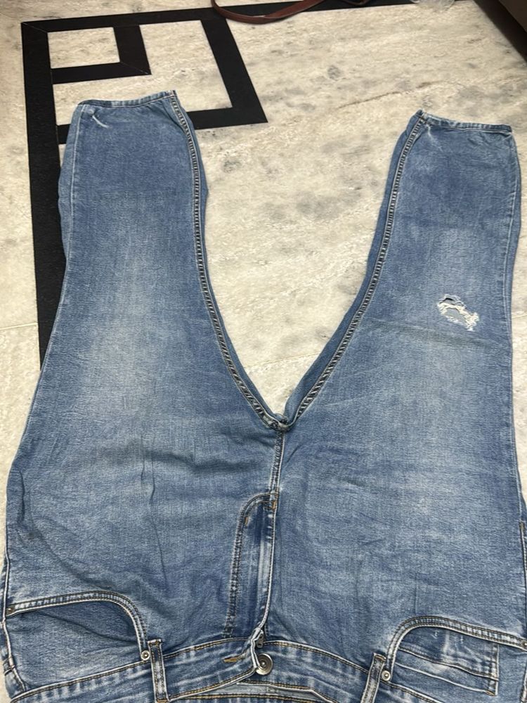 Blue Denim Jeans with Distressed Detail