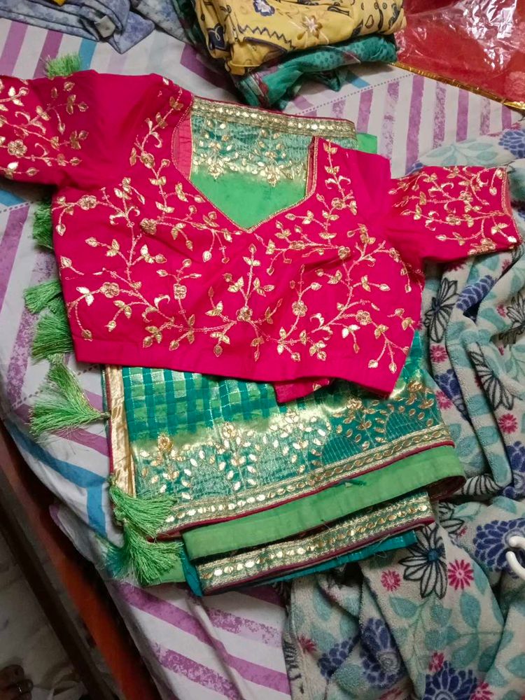 Embroidered Pink Blouse with Green Saree