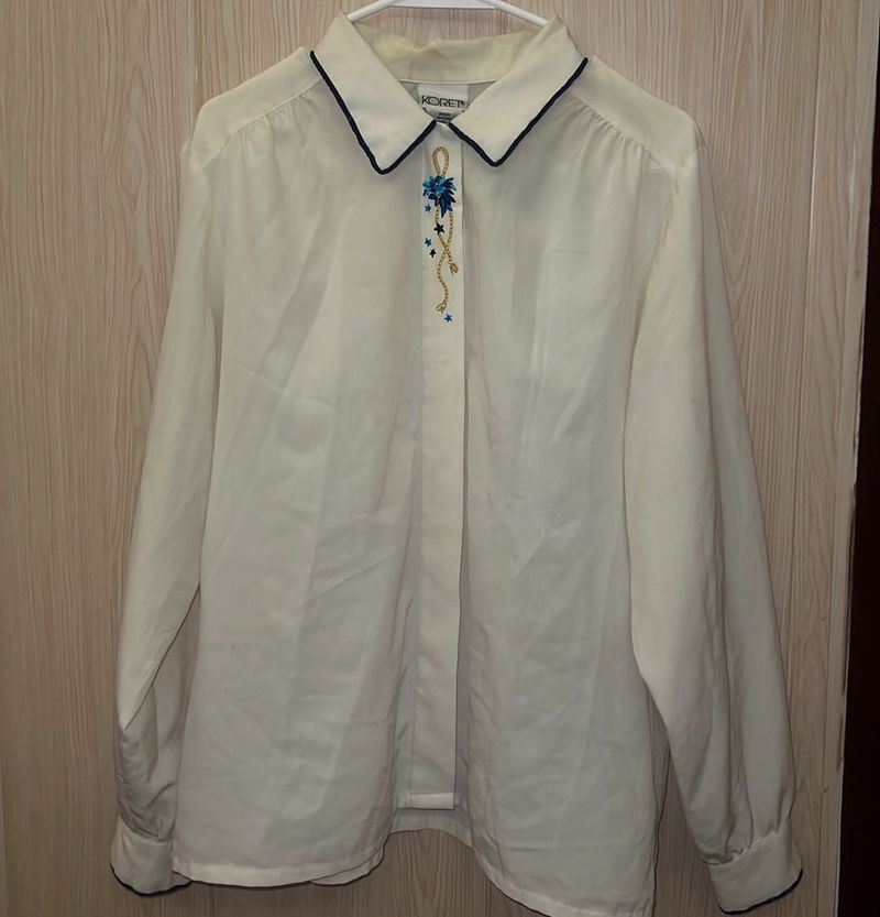 Elegant Cream Blouse with Blue Embroidery