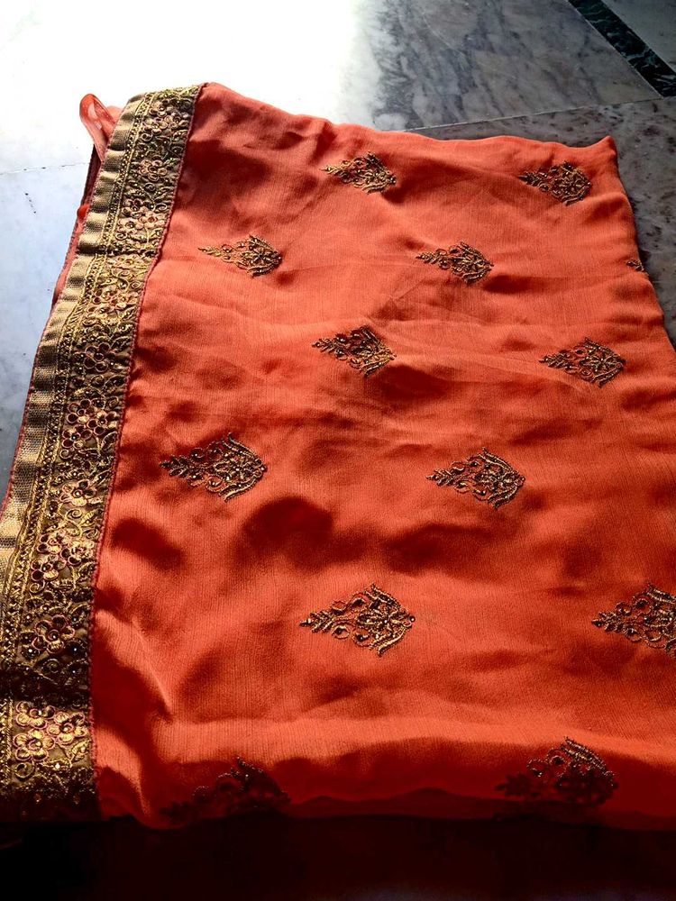 Elegant Orange Embroidered Saree
