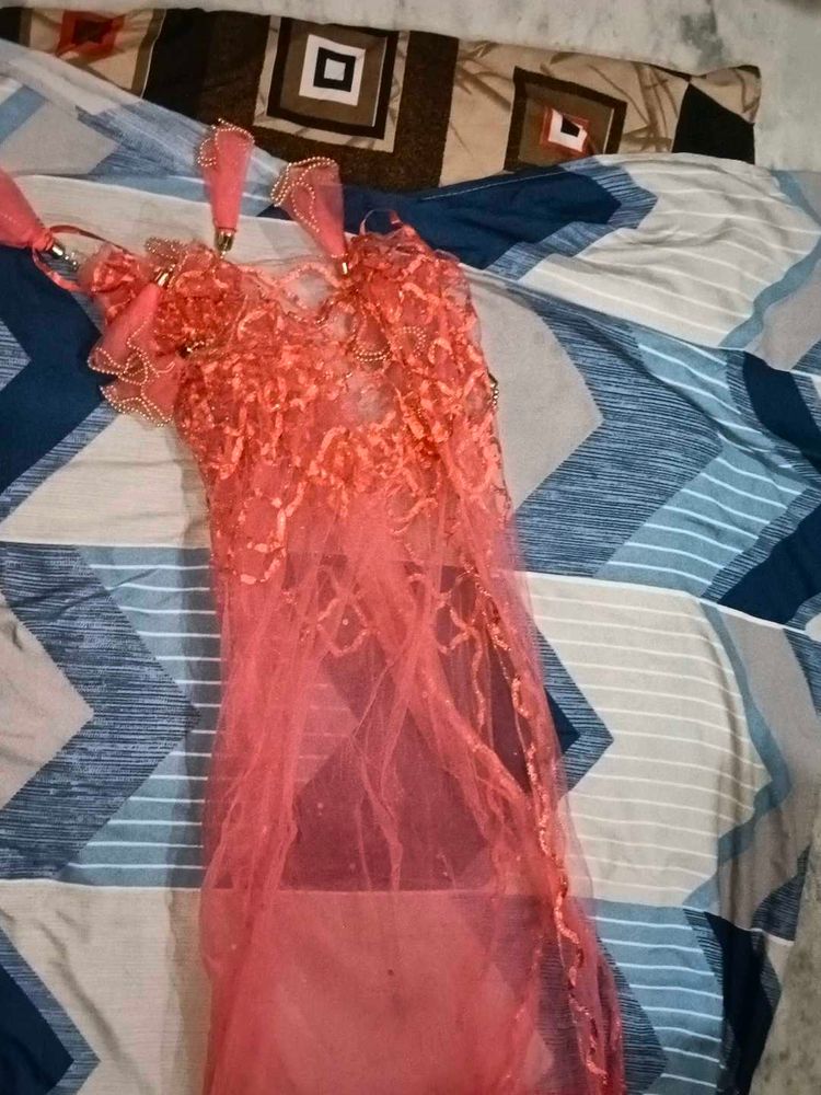 Orange Net Embellished Lehenga Choli