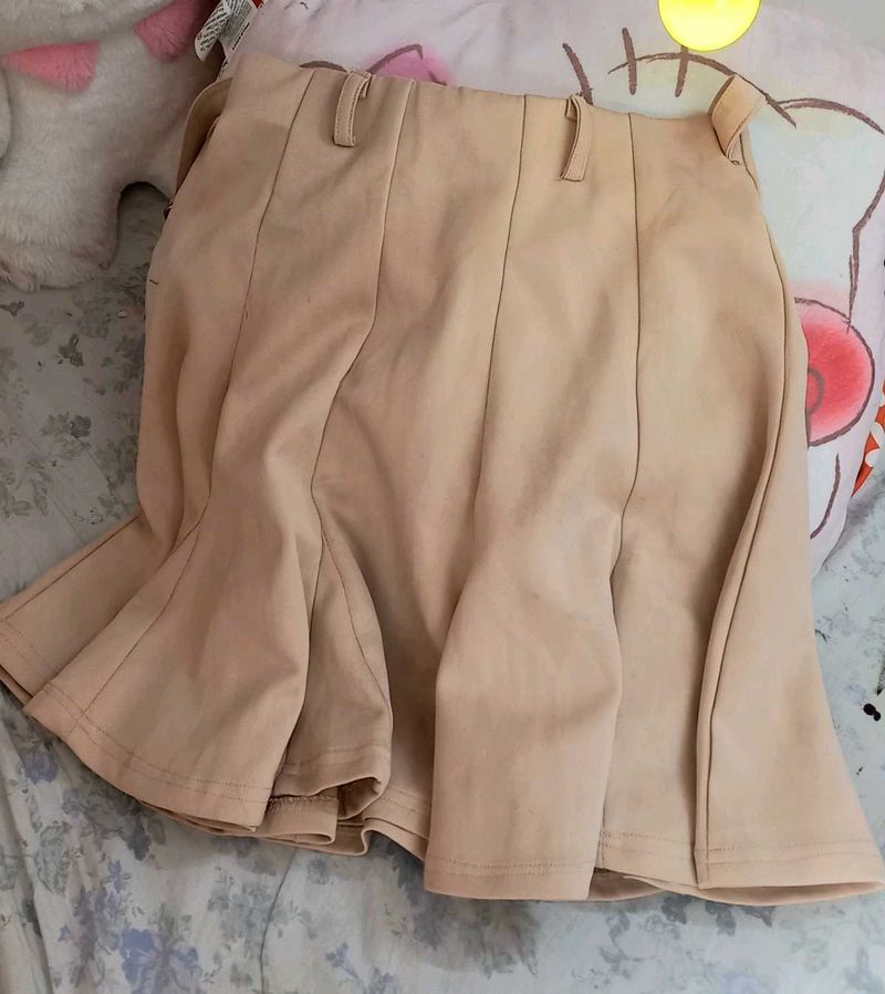 beige skirt or skort with in-built shorts
