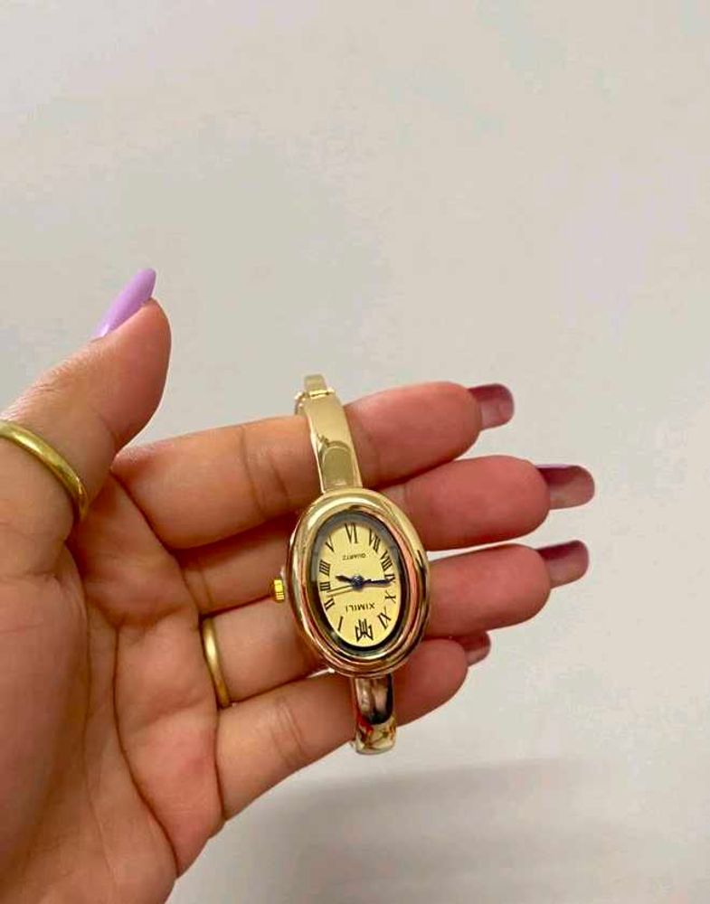 Elegant Gold Oval Bangle Watch